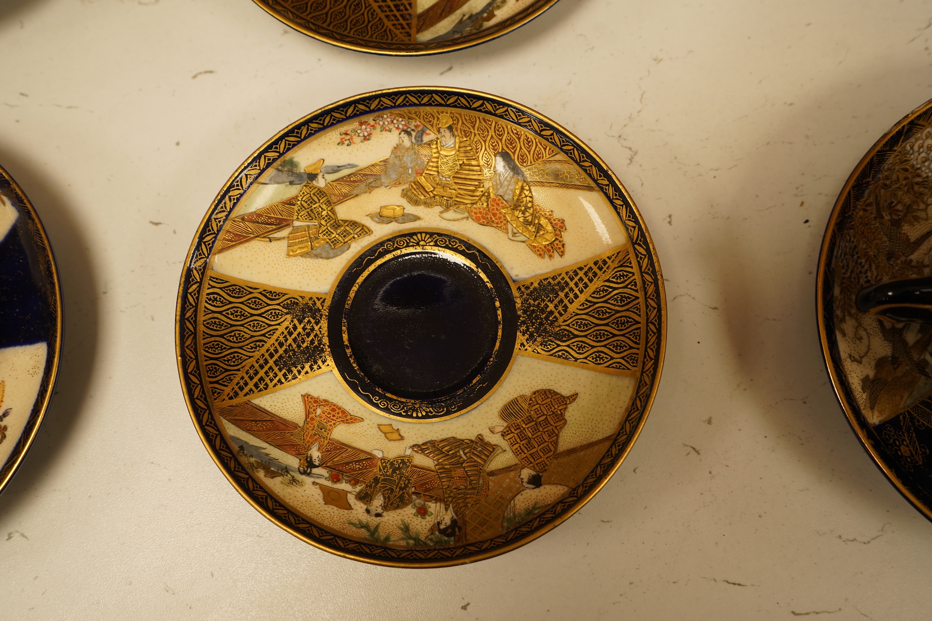 A set of six Japanese Satsuma pottery teacups and saucers, and two further saucers